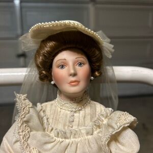 Elegant Porcelain Doll with Cream Dress